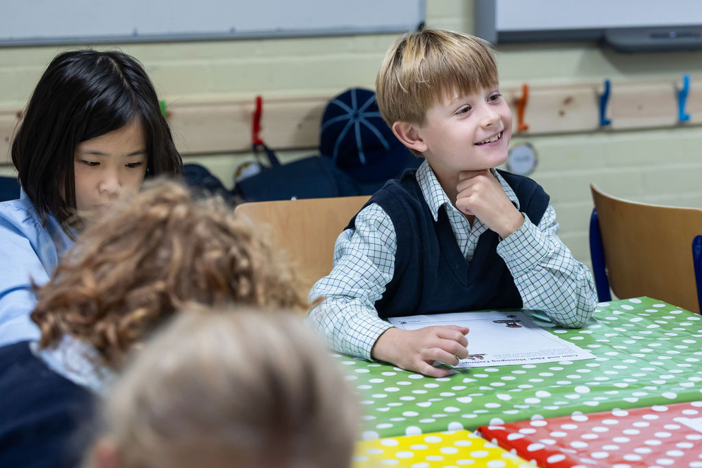 A Horris Hill School pupil sits at a classroom table
