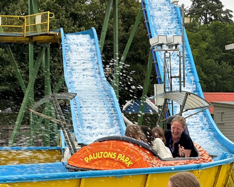 Boarding students with their houseparent on a log flume